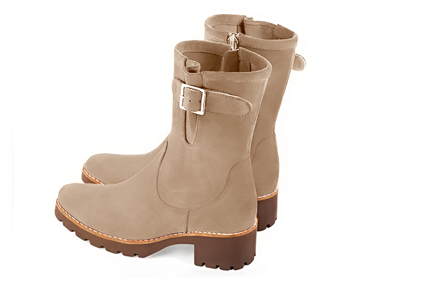 Tan beige women's ankle boots with buckles on the sides. Round toe. Low rubber soles. Rear view - Florence KOOIJMAN